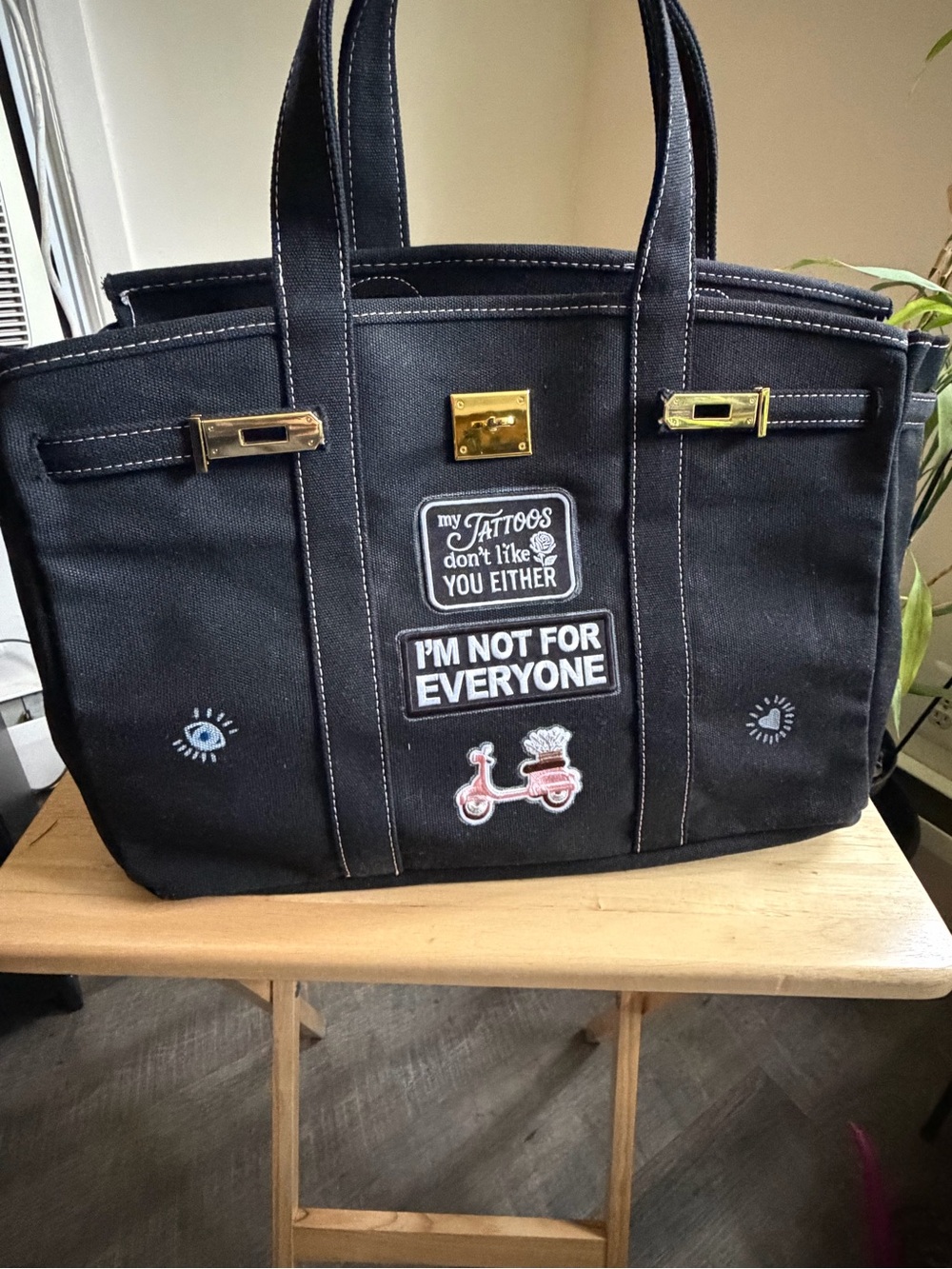 Black Canvas Tote Bag with Gold Hardware and Patch Details